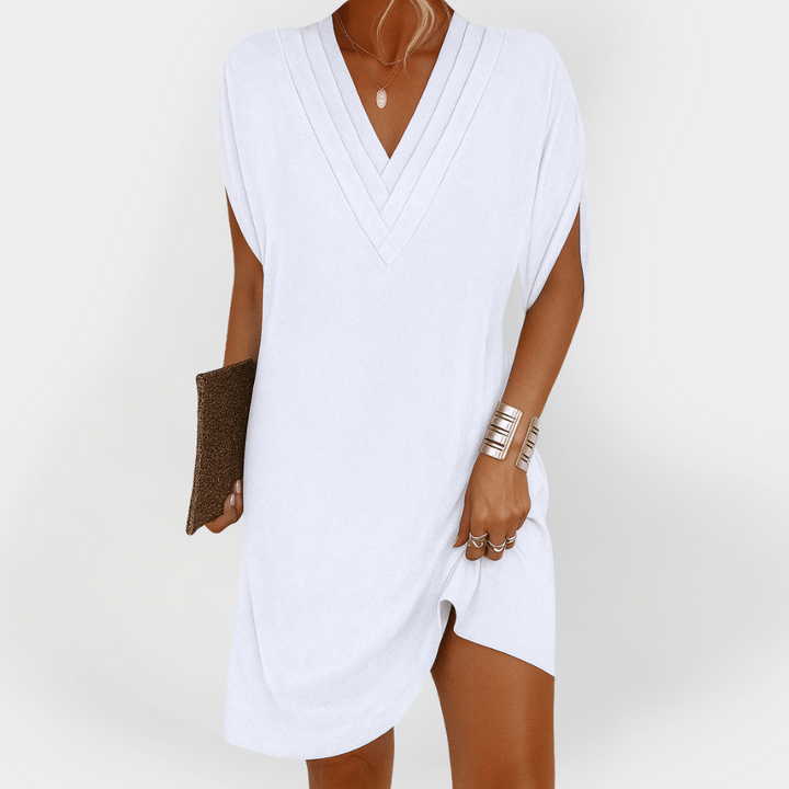 Eleganten oblek s flattering krojem
